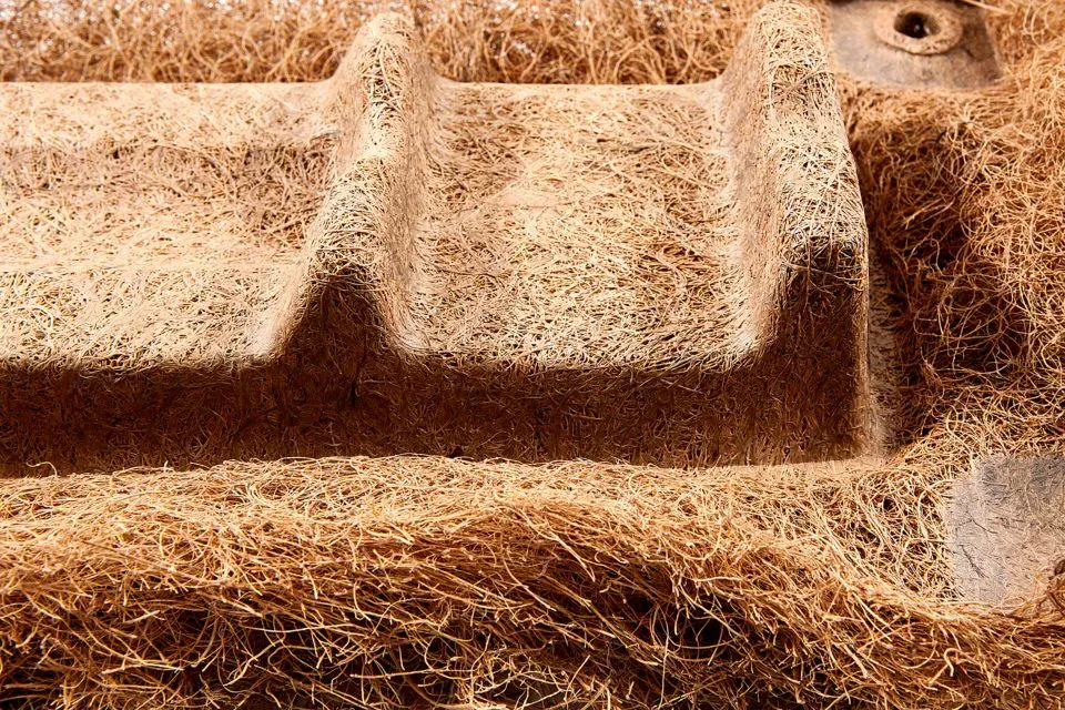 A close-up photograph of "cocoform," a material made from coconut fibers and latex.